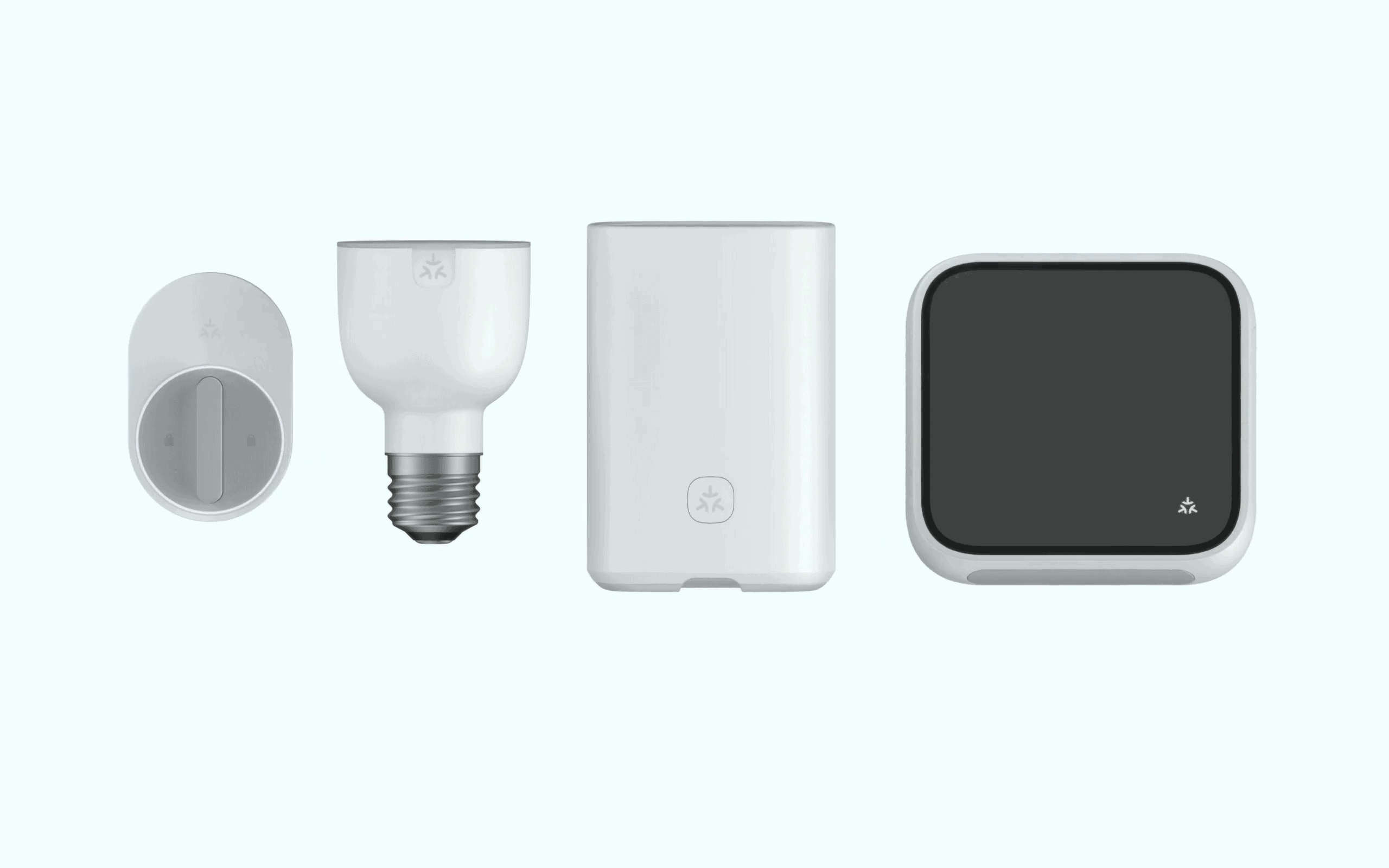 A smart lock, smart light, router, and smart display all displaying the Matter symbol.