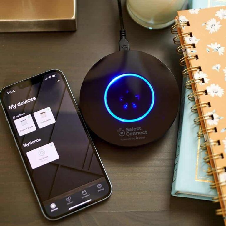 SelectBlinds SelectConnect bridge with a cell phone showing their app.
