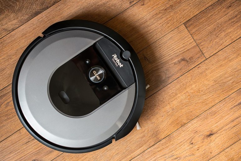 iRobot Roomba i7 robot vacuum cleaner on a wooden floor