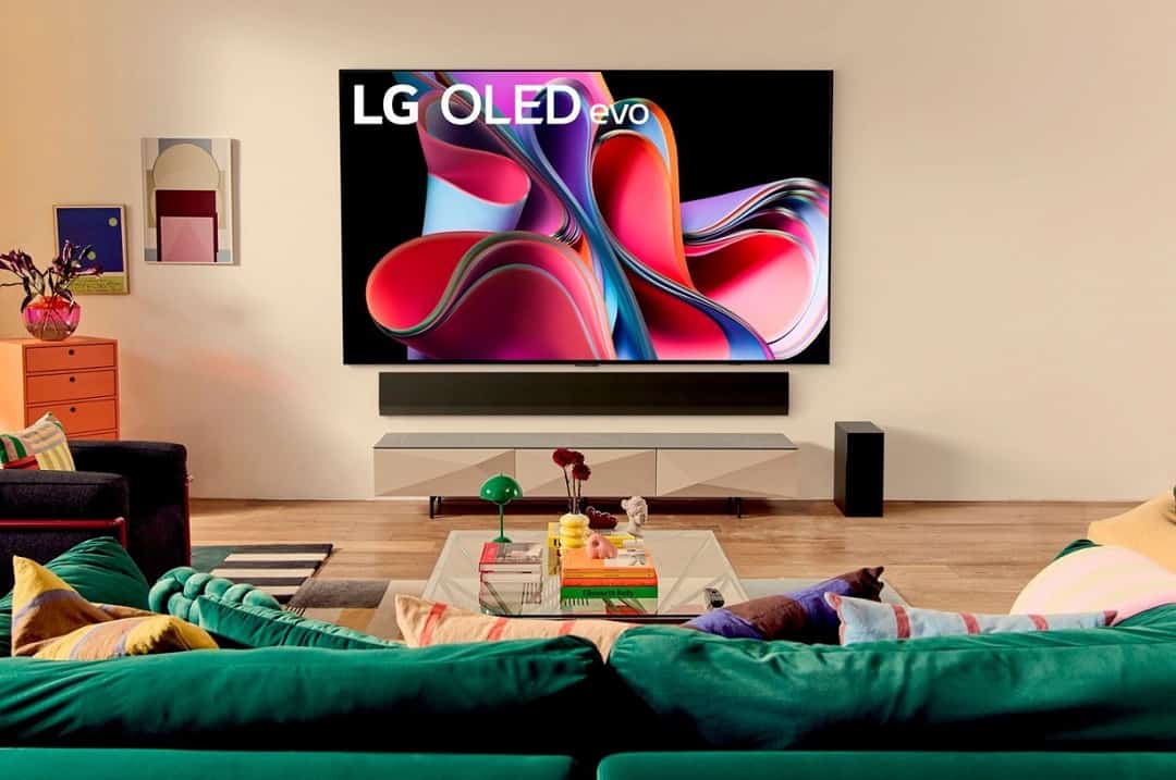 LG OLED Evo tv in a brighly colored modern living room.