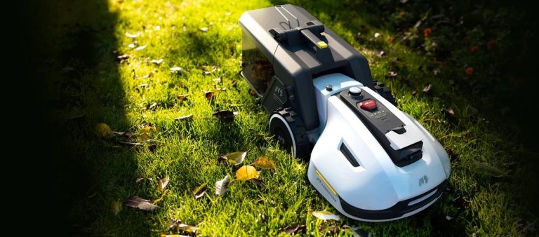 MAMMOTION YUKA robotic lawn mower on grass.