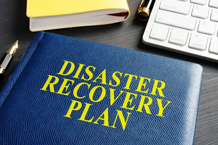 Disaster Recovery Plan journal on an office table.