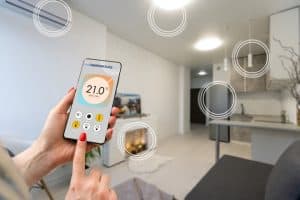 Cell phone controlling a smart home with smart home items circled.